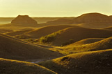 Sunrise over badlands and Castle Butte, Big Muddy Badlands