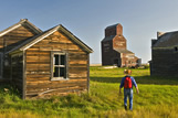 A hiker walks through the ghost town of Bents